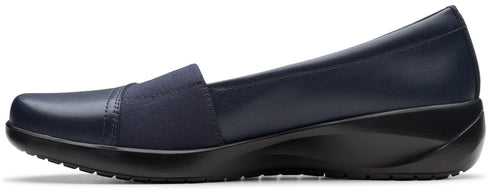 Navy slip-on shoe with a low wedge heel.