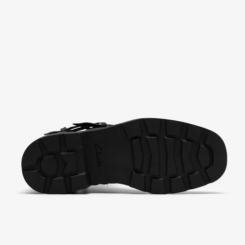 Black lug sole with visible "Clarks" logo.