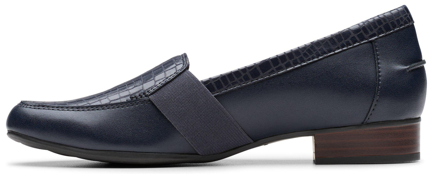 Navy blue loafer with a block heel and a textured upper.