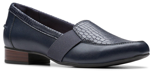 A dark blue leather loafer with a reptile skin accent and a low block heel.