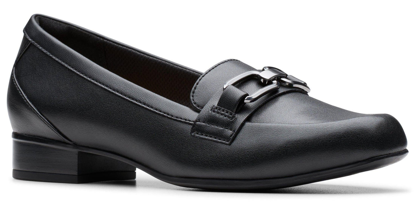 A black leather loafer with a square toe and a metallic accent on the top.