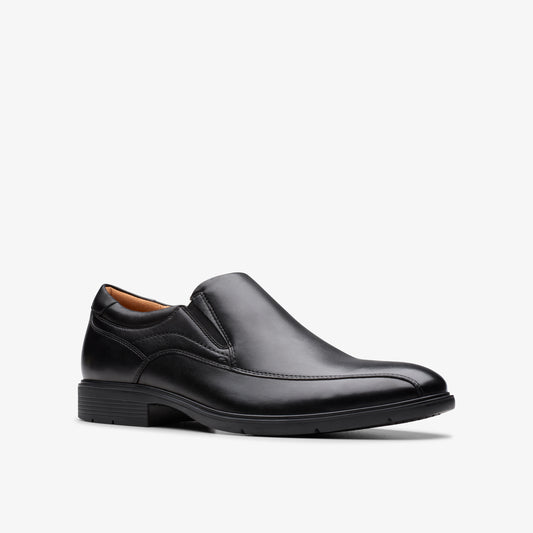 Black leather slip-on dress shoe with a rounded toe and a stacked heel.