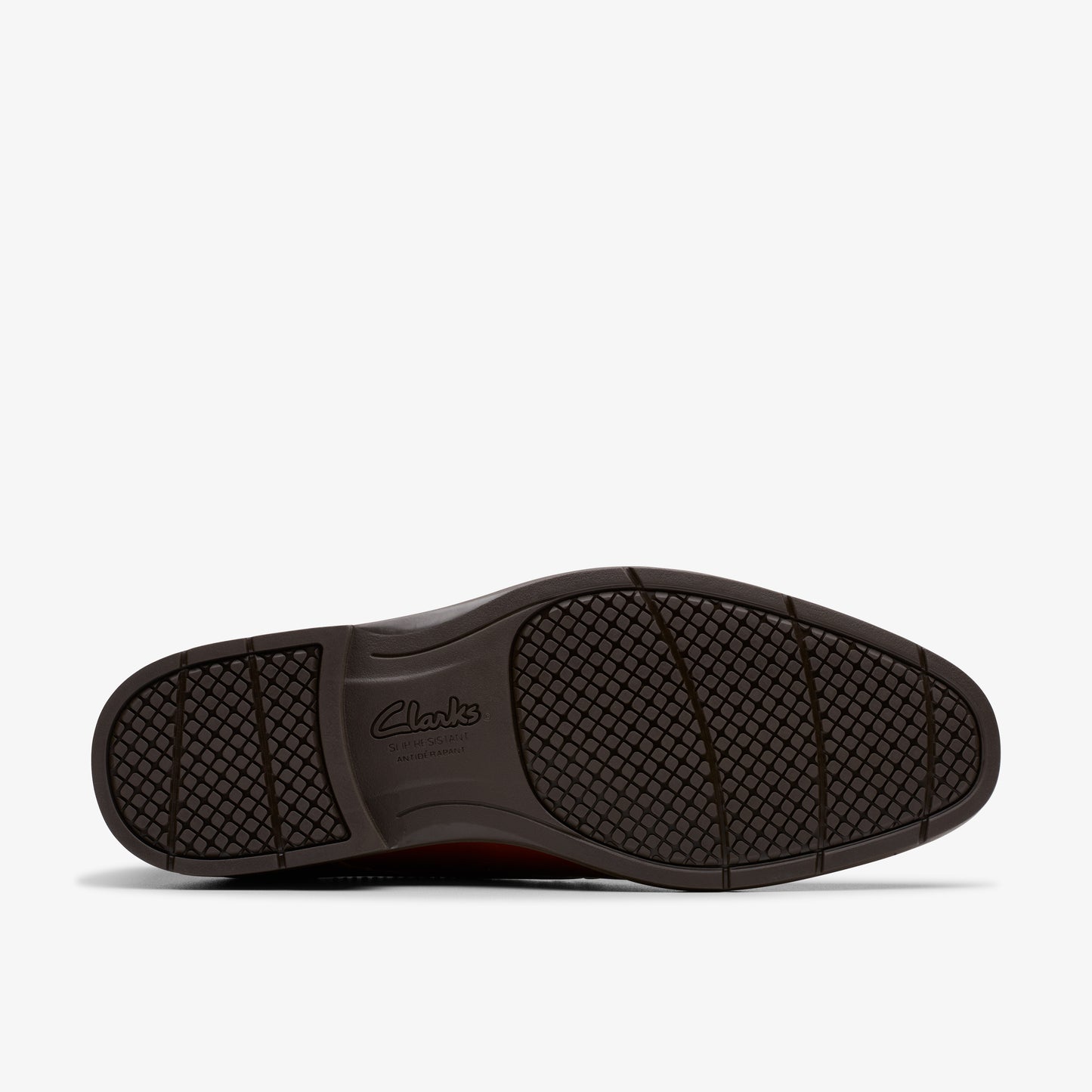 Close-up of a brown shoe's sole with visible brand name 'Clarks'.