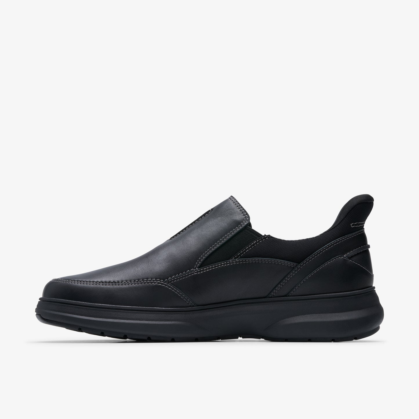 A black leather slip-on shoe with a rounded toe and a thick sole.