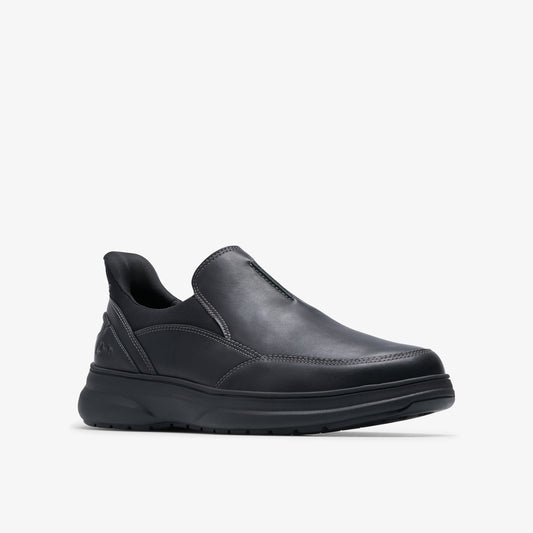 Black leather slip-on shoe with a rounded toe and thick black sole.
