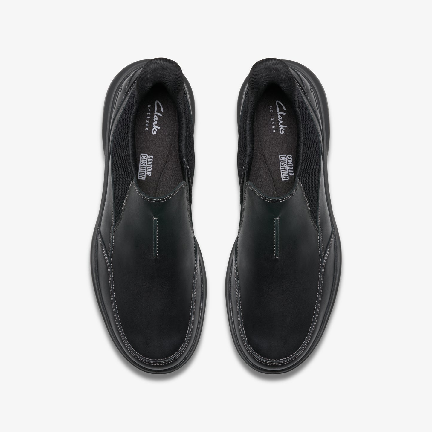 Overhead view of two black slip-on shoes with visible "Clarks" logo.