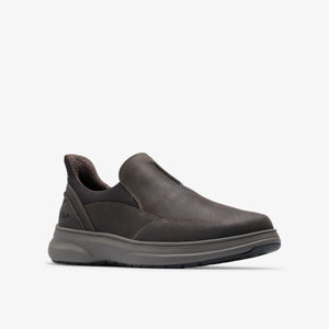 Slip-on shoe in dark brown with rounded toe and thick, gray sole.