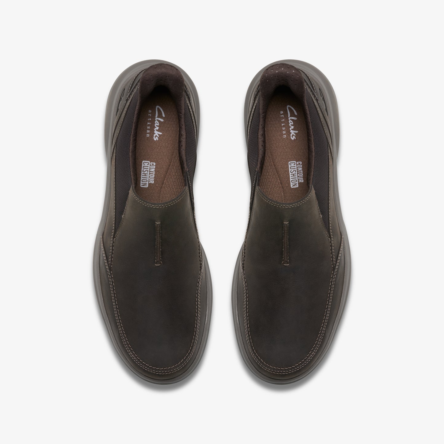 Pair of brown leather slip-on shoes, top view.