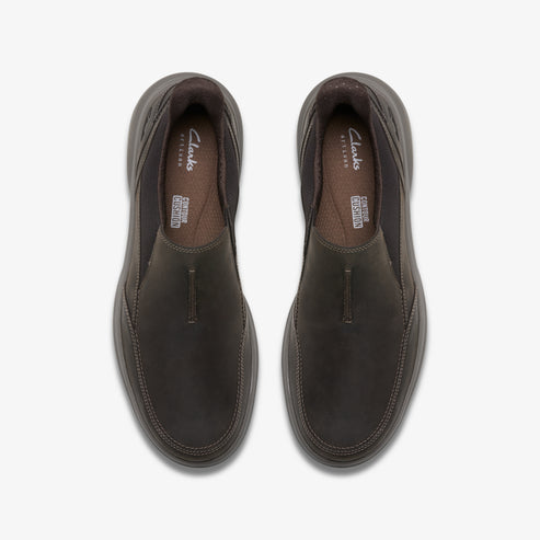 Pair of brown leather slip-on shoes, top view.