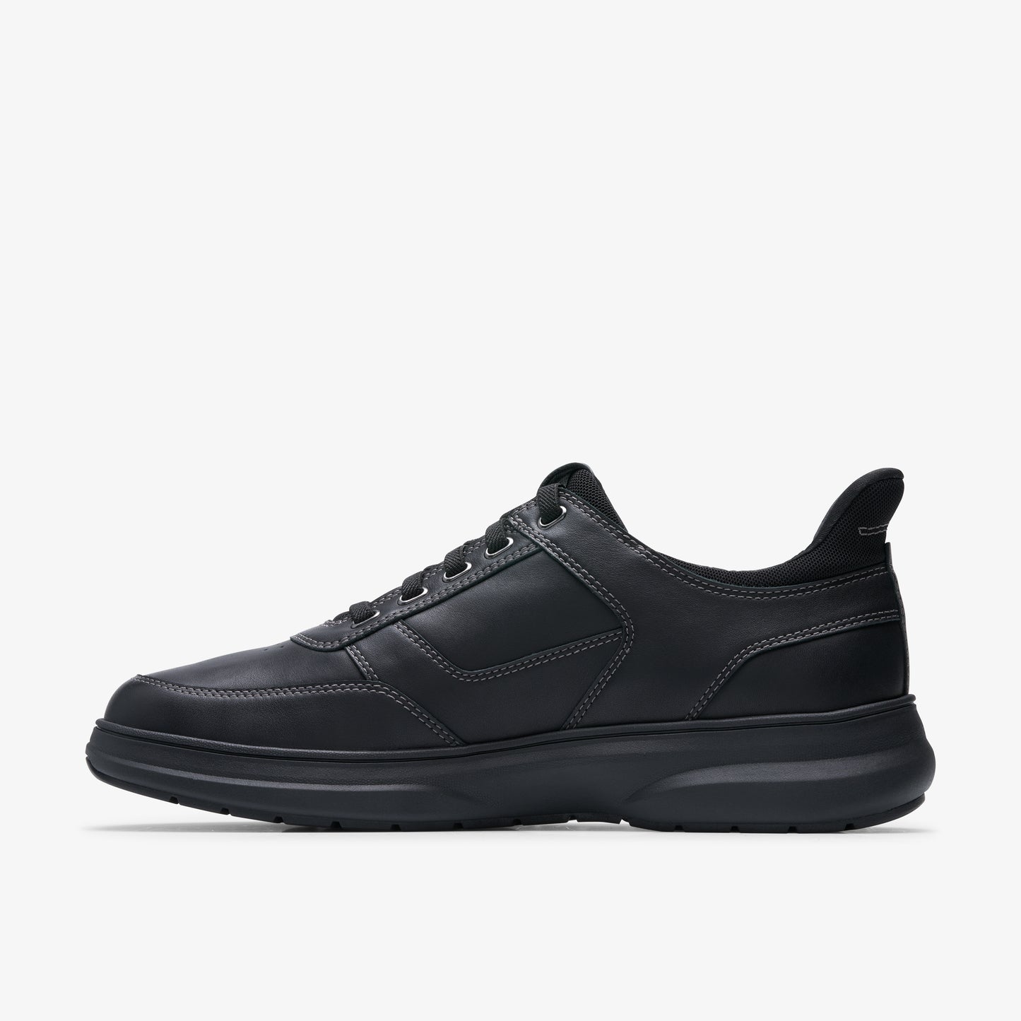 Black leather sneaker with tonal stitching and dark sole.