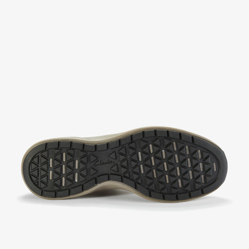 Bottom of shoe with triangular tread pattern and 'Clarks' logo.