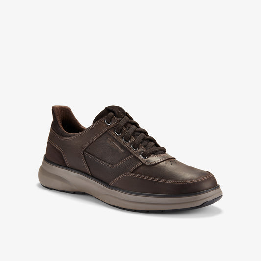 A brown leather lace-up sneaker with a gray sole.