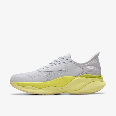 Light gray running shoe with bright yellow cushioned sole.