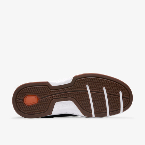 Brown rubber shoe outsole with white midsole and linear grip pattern.