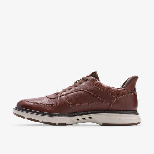 Brown leather lace-up sneaker with white sole.