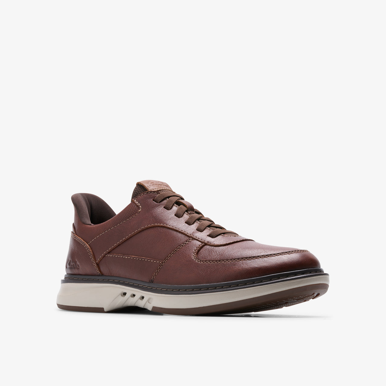 Brown leather sneaker with dark laces and a thick, light-colored sole.
