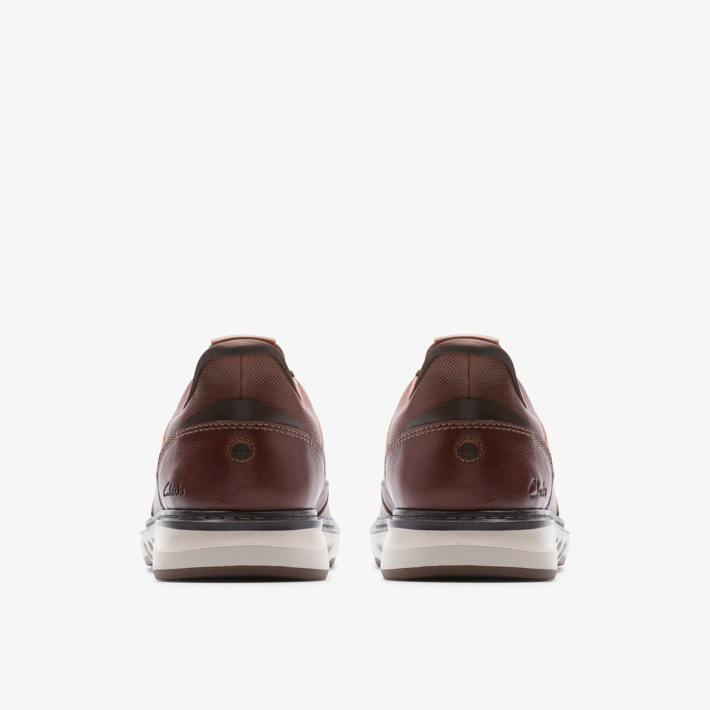 Two brown leather sneakers with white soles, seen from the back.