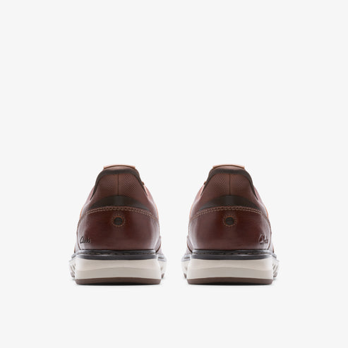 Two brown leather sneakers with white soles, seen from the back.