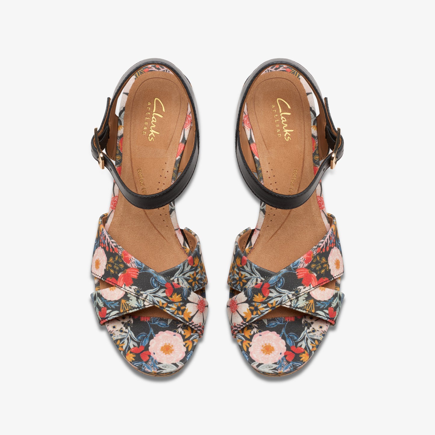 Overhead shot of floral print heeled sandals with black ankle straps.