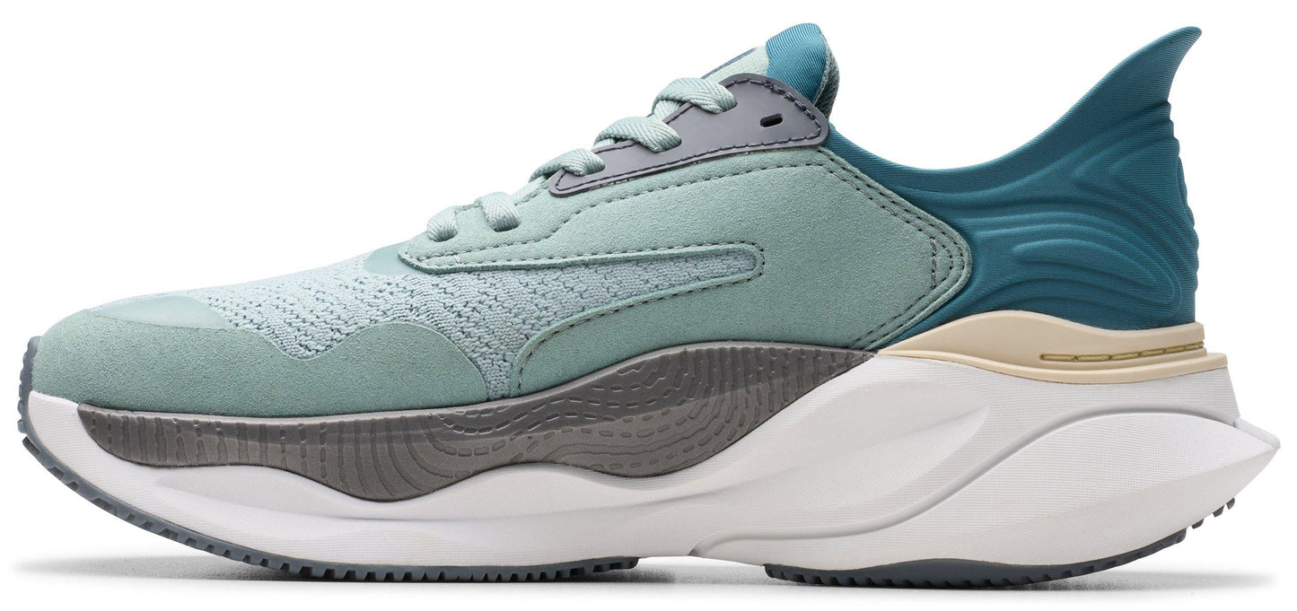A running shoe featuring a mesh upper, a two-tone midsole, and a teal colored heel.