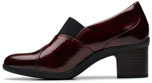 Dark red, shiny leather, block heel shoe with black elastic detail.