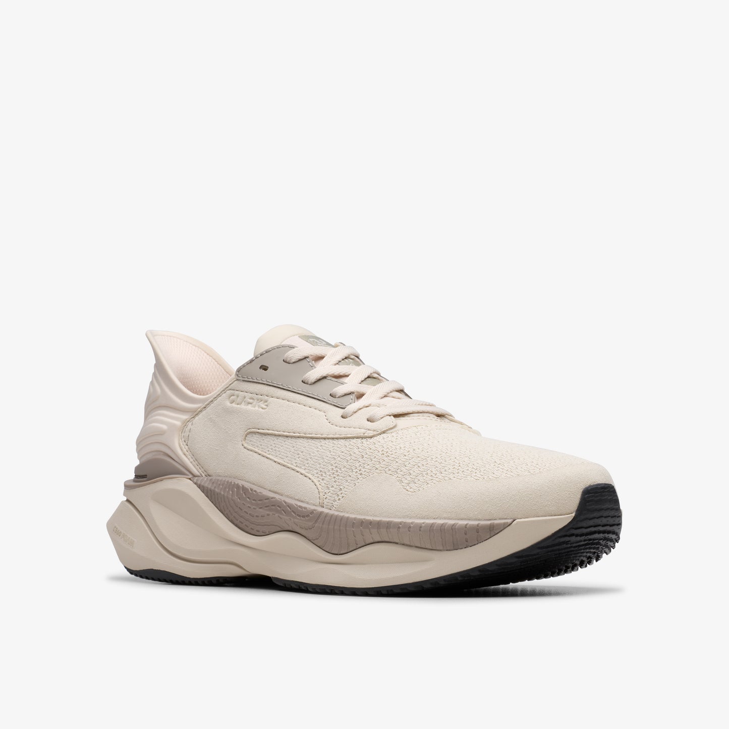Off-white athletic shoe with thick contoured sole and gray accents.