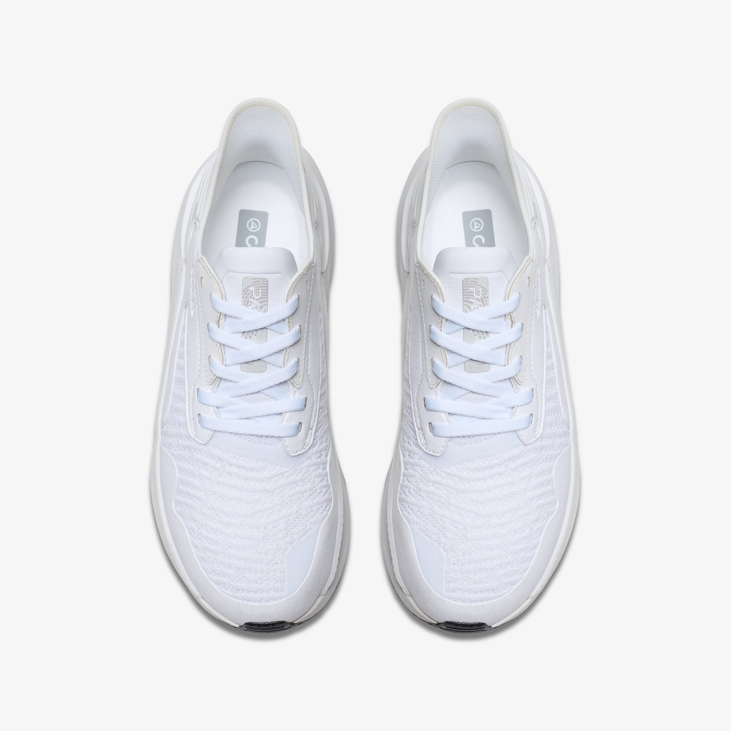 Pair of white running shoes with laces.