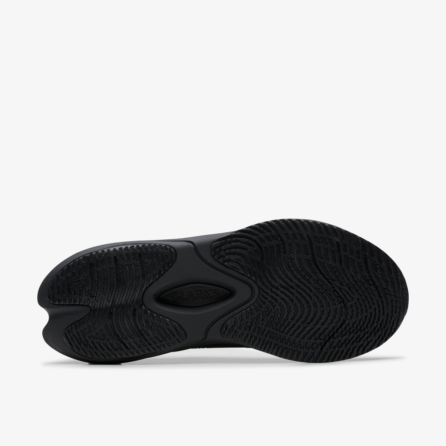 Black running shoe sole with intricate tread pattern and central oval design.