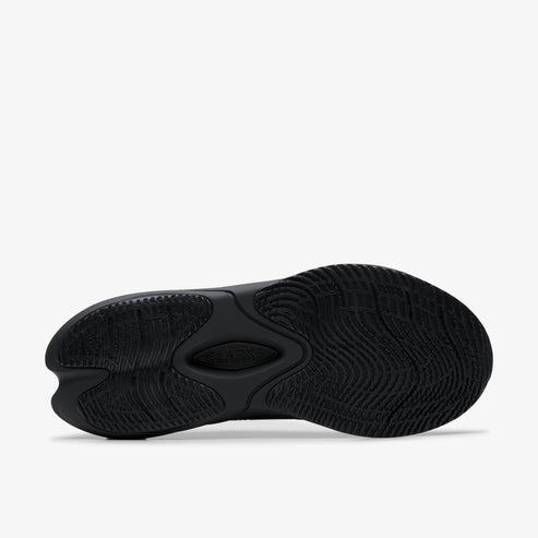Black running shoe sole with intricate tread pattern and central oval design.