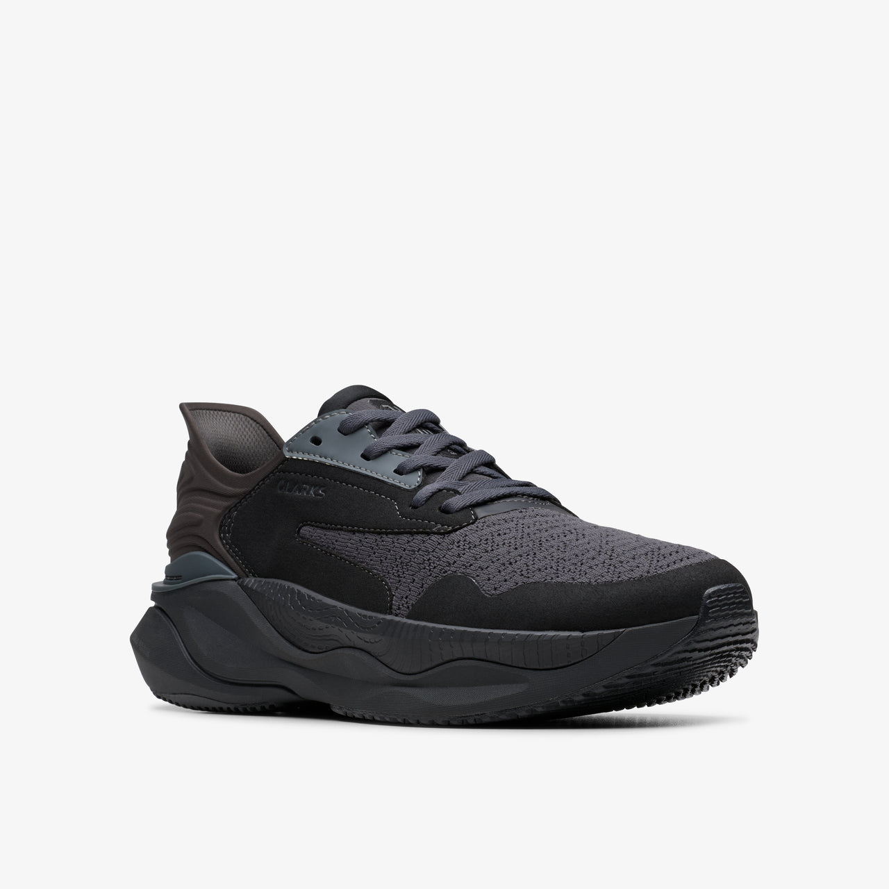 Black sneaker with gray laces and rubber soles.