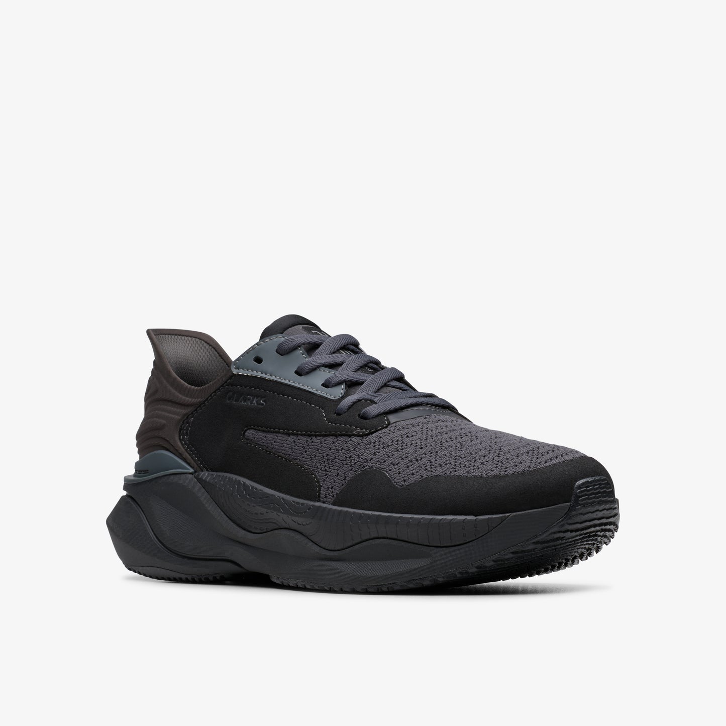 Black sneaker with gray laces and rubber soles.