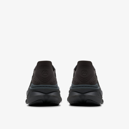 Rear view of a pair of low-profile, dark-colored athletic shoes with sculpted heel and patterned upper.