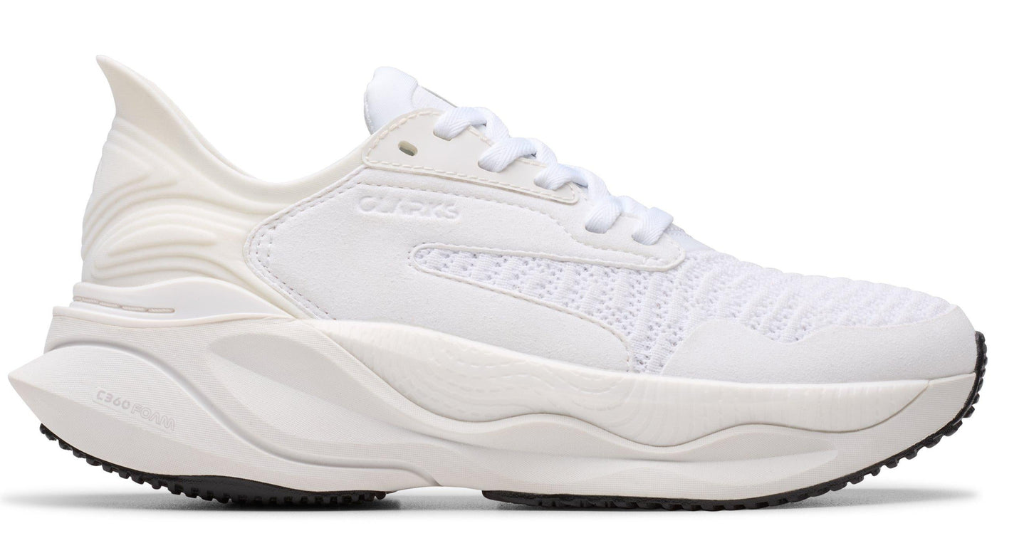 Side view of a white running shoe with white laces and a thick, patterned sole and heel.