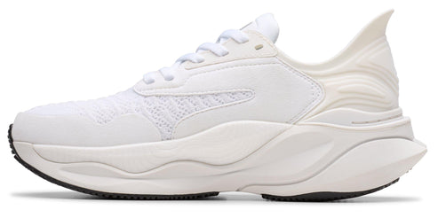A white athletic shoe featuring a chunky sole and intricate upper design.