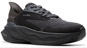 CLARKS running shoe with black mesh upper and thick, sculpted black sole.