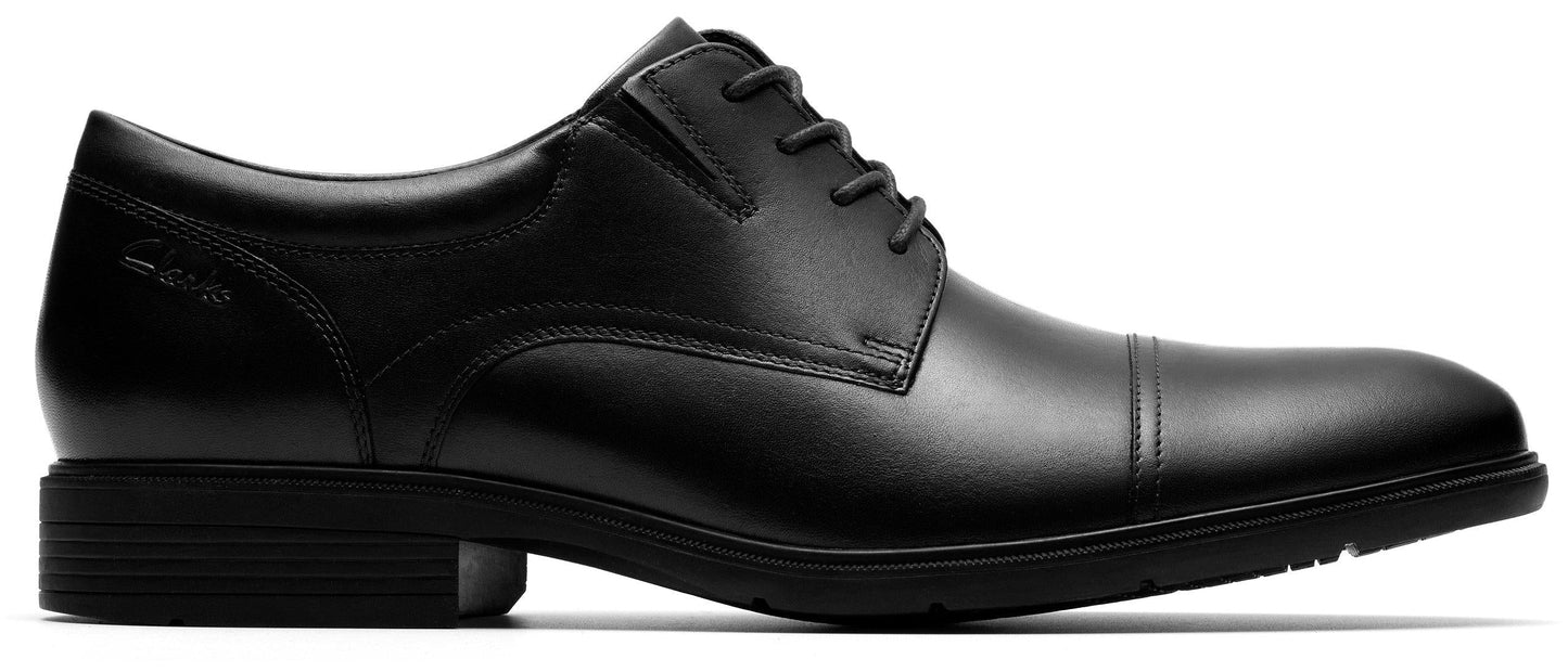 Black leather dress shoe with lace-up closure.