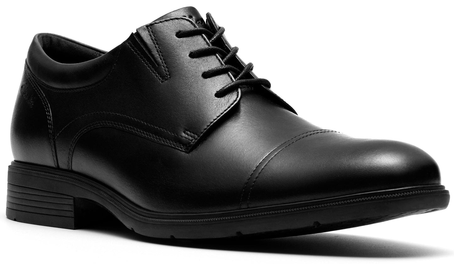 Black cap-toe dress shoe with lace-up closure and low heel.