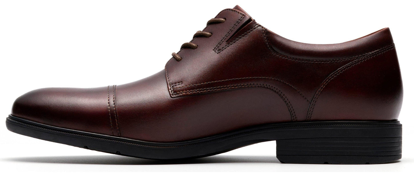 A low-heeled, dark red-brown dress shoe with laces.