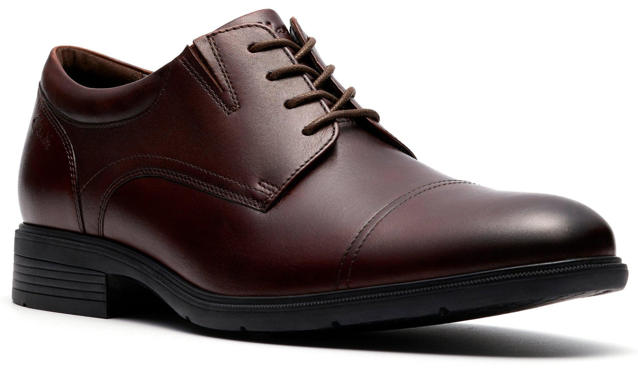 Burgundy leather dress shoe with cap toe and lace up closure.