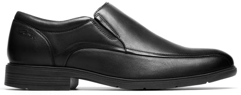 A black leather slip-on dress shoe.
