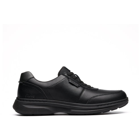 A black leather athletic shoe with laces and a low profile.