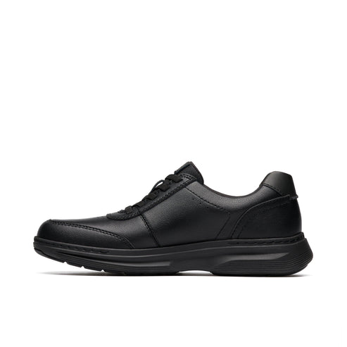 Black leather casual shoe with a rounded toe and flat sole.