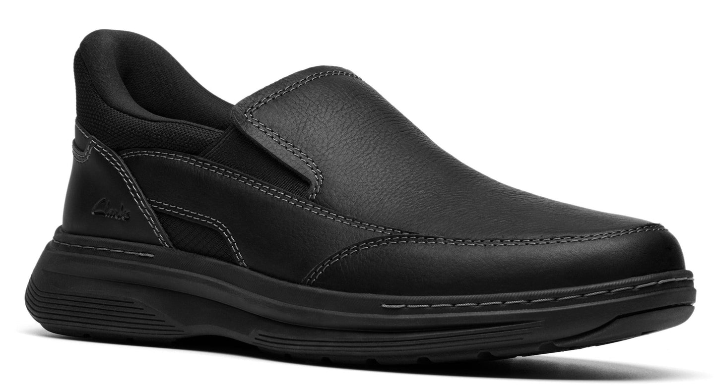 Black slip-on shoe with leather upper and thick sole.