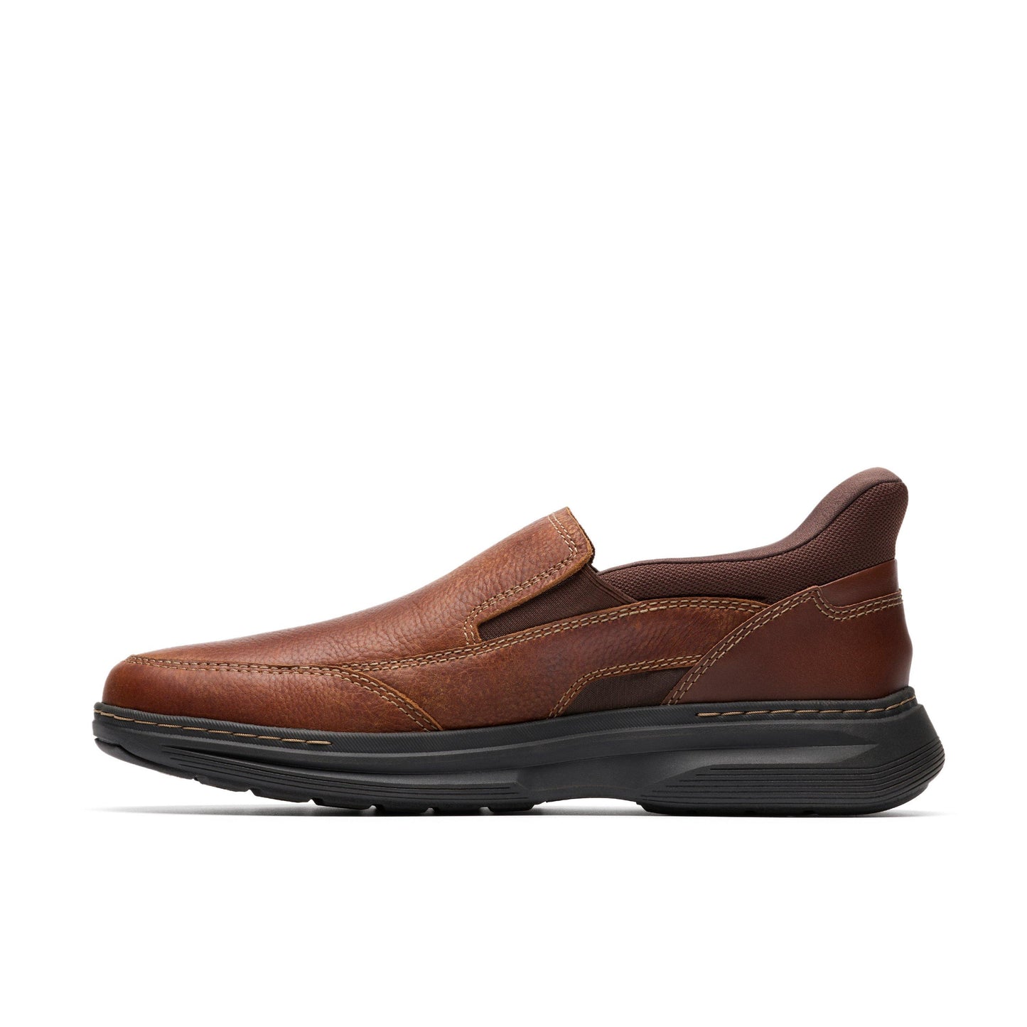 A brown leather slip-on shoe with a black sole.