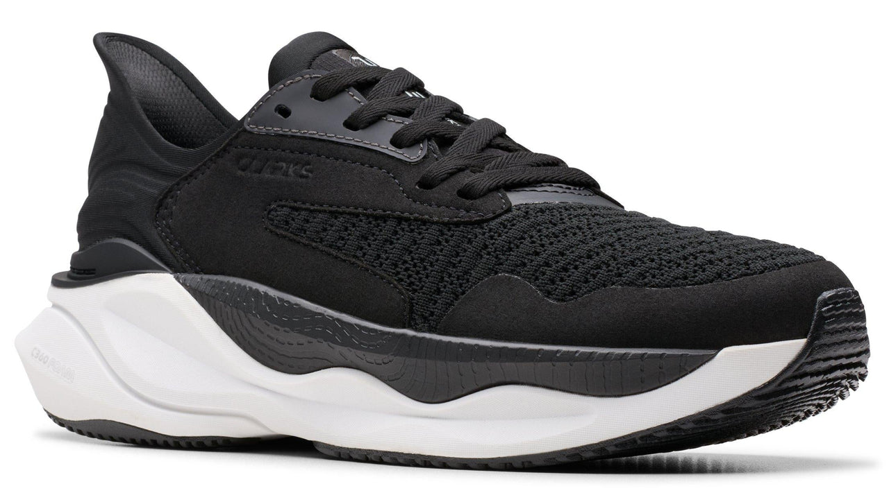 Black athletic shoe with a thick white sole and black laces.
