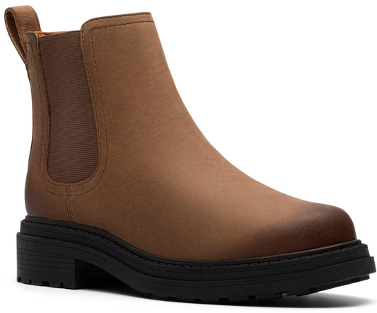 Brown leather Chelsea boot with black sole and elastic side panels.