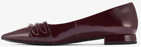 A shiny, dark red, women's dress shoe.