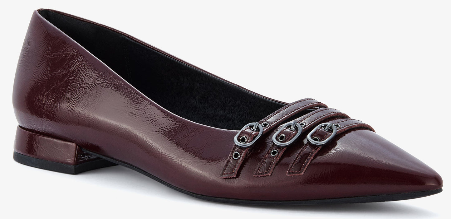 Maroon leather pointed-toe flat with three straps across the toe box with silver buckles.