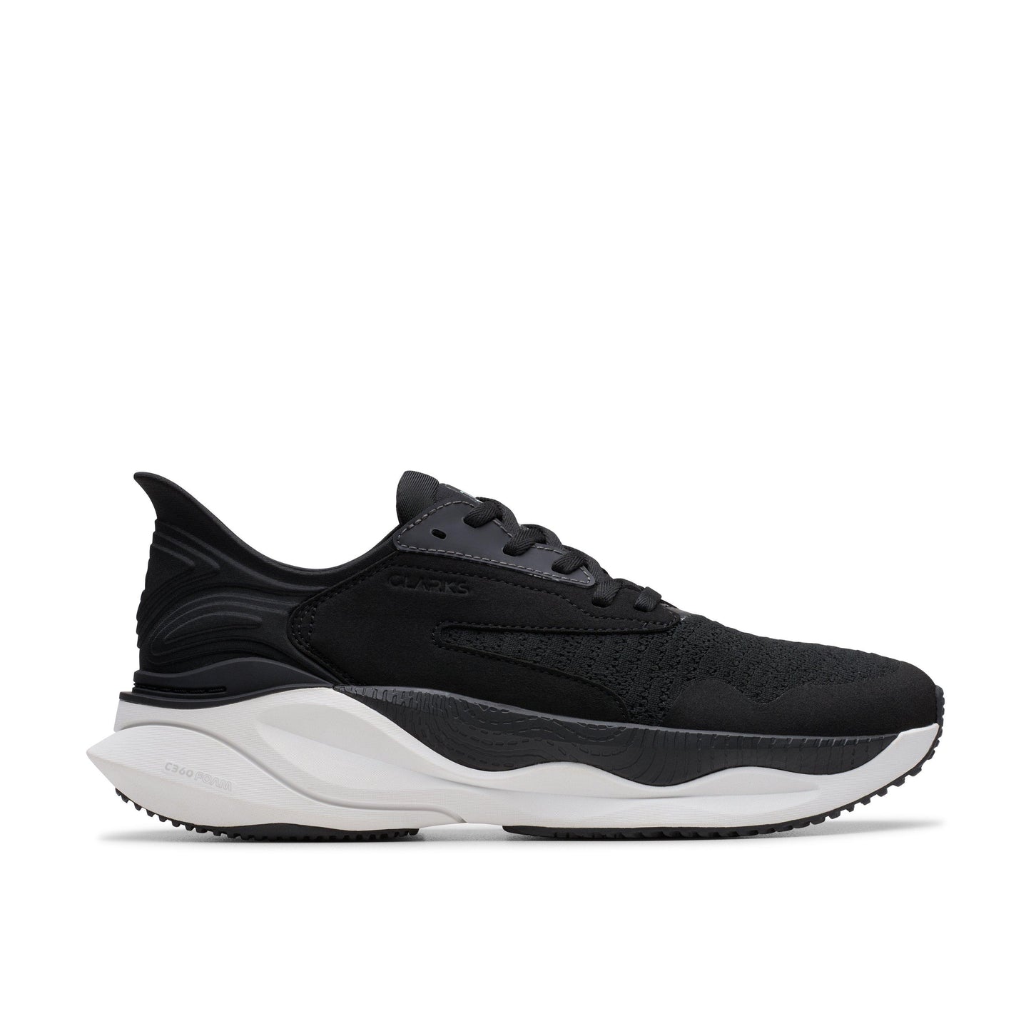 A black running shoe with white sole.