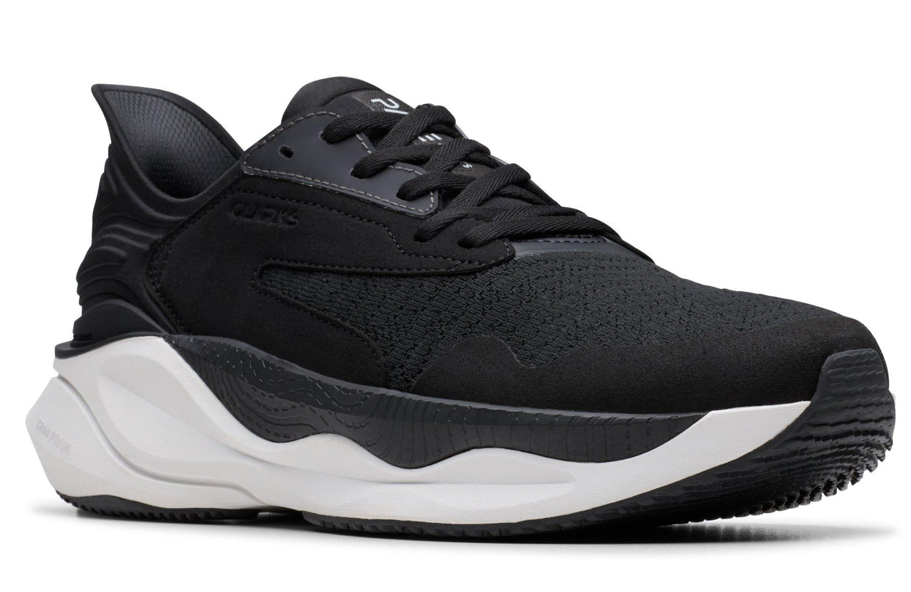 Black running shoe with white sole.